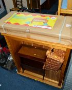 A BOXED PINE BENCH, a pine bookcase, a pine toy box, a magazine rack, basket and an occasional table