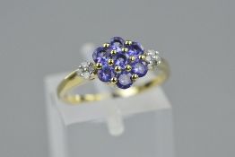 A 9CT TANZANITE AND DIAMOND RING, ring size M, approximate weight 2.7 grams (certificate)