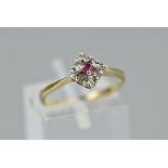 A 9CT RUBY AND DIAMOND CLUSTER RING, ring size L1/2, approximate weight 1.9 grams