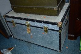 A MODERN TRUNK, with metallic covering