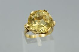 A LATE 20TH CENTURY SINGLE STONE CITRINE RING, a large round mixed cut citrine measuring