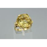 A LATE 20TH CENTURY SINGLE STONE CITRINE RING, a large round mixed cut citrine measuring