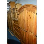 A CORONA THREE DOOR WARDROBE, a matching two door wardrobe, a pair of bedsides CD rack and chest
