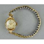 A LADIES 9CT ROTARY WRISTWATCH, on plated expandable strap