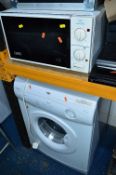 AN HOTPOINT TDL30 TUMBLE DRYER, and an Iceline microwave (above) (2)