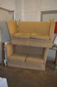 A KNOWLE STYLE GOLD UPHOLSTERED TWO PIECE SUITE, comprising of two two seater sofas (NO CASTERS)