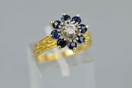 A LATE 20TH CENTURY SAPPHIRE AND DIAMOND CLUSTER RING, a round cluster centering on a modern round