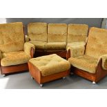 A G-PLAN TEAK FOUR PIECE SADDLE LOUNGE SUITE, with gold upholstery, Pirelli padding on orbit