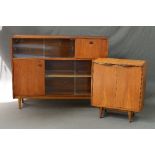 A NATHAN TEAK BOOKCASE IN THE STYLE OF ROBERT HERITAGE, with two tiered glazed sliding doors, fall