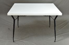 A RECTANGULAR 1960'S FORMICA TOPPED DINING TABLE, on painted shaped metal legs, approximate size