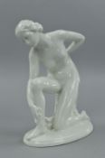 A ROSENTHAL BLANC DE CHINE FIGURE OF A LADY DRYING HERSELF, modelled by Karl Lysek, printed