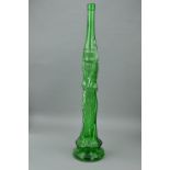 A LARGE GREEN DECORATIVE GLASS BOTTLE SHAPED AS A WOMAN HOLDING A BOTTLE ABOVE HER HEAD, Art Nouveau