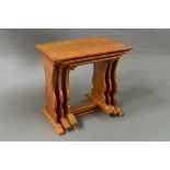 ALAN ACORNMAN GRAINGER OF BRANDSBY, YORK, an oak nest of three tables, on two shaped supports