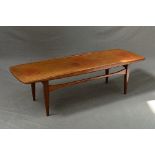 A 1960'S TEAK SURF TABLE, in the style of Grete Jalk, the top with raised sides down to curved ends,