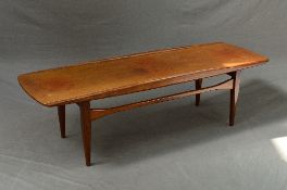 A 1960'S TEAK SURF TABLE, in the style of Grete Jalk, the top with raised sides down to curved ends,