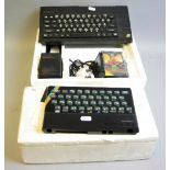 A SINCLAIR ZX SPECTRUM PLU, with power supply, three games, polystyrene box, a ZX Spectrum case (