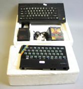 A SINCLAIR ZX SPECTRUM PLU, with power supply, three games, polystyrene box, a ZX Spectrum case (