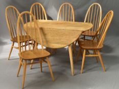 AN ERCOL BLONDE DROP-LEAF TABLE, with rounded leaves to form an oval, approximate size length