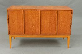 A DANISH STYLE TEAK RECORD CABINET, with double bi-fold doors on square tapering legs, record