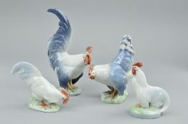 TWO PAIRS OF ROYAL COPENHAGEN COCKERELS AND HENS, designed by Christian Thomsen, model numbers 1024,