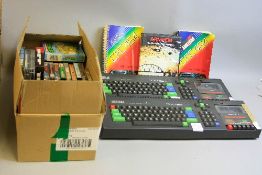 TWO AMSTRAD CPC464 VINTAGE PERSONAL COMPUTERS, with manuals and a box of over sixty games, no