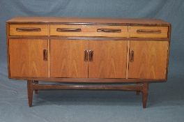 A G-PLAN FRESCO TEAK SIDEBOARD, flanked by four drawers above four cupboard doors, approximate