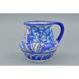 A CHARLOTTE RHEAD FOR CROWN DUCAL JUG, decorated in the 'Blue Peony' pattern, painted name and