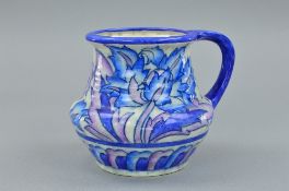 A CHARLOTTE RHEAD FOR CROWN DUCAL JUG, decorated in the 'Blue Peony' pattern, painted name and