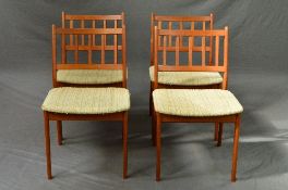 A HUGO FRANDSEN SPOTTRUP, a set of four teak dining chairs with stick back and upholstered seats (