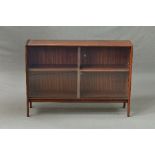 A 1970'S DANISH STYLE TEAK BOOKCASE, with double glazed sliding doors, on 'A' shaped legs,