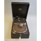 A HMV TABLE TOP GRAMOPHONE, in a black Tolex case with winding handle (missing hand grip)