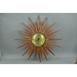 ANSTEY & WILSON 1960'S TEAK AND BRASS SUNBURST WALL CLOCK, approximate diameter 63cm (s.d. to