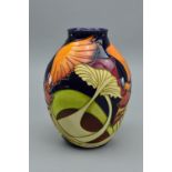 A MOORCROFT 'PARASOL DANCE' BALUSTER VASE, designed by Kerry Goodwin and dated 2005, it bares the