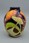 A MOORCROFT 'PARASOL DANCE' BALUSTER VASE, designed by Kerry Goodwin and dated 2005, it bares the