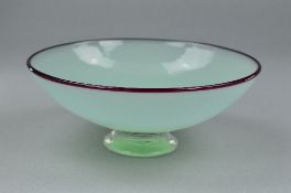 NEIL WILKIN, AN EARLY STUDIO ART GLASS BOWL, with pale green body topped with a burgandy red rim