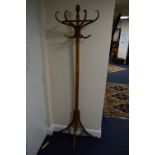 A 20TH CENTURY WALNUT BENTWOOD STYLE WALL STANDING SINGLE SIDED HAT STAND, approximate height 199cm