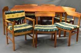 A GORDON RUSSELL OF BROADWAY TEAK RECTANGULAR EXTENDING DINING TABLE, on square block legs, with
