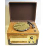 A FERGUSON RECORD PLAYER, with radio and valve amplifier, the turntable is a bakelite Garrard and