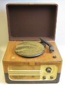 A FERGUSON RECORD PLAYER, with radio and valve amplifier, the turntable is a bakelite Garrard and