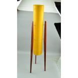 A 1960'S/1970'S TEAK FLOOR STANDING ROCKET LAMP, having cylindrical yellow fibre glass shade,