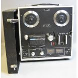 AN AKAI 1721L FOUR TRACK STEREOPHONIC REEL TO REEL RECORDER, with lid (untested)