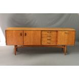 A G-PLAN TEAK SCANDINAVIAN SIDEBOARD, designed by W.B. Wilkins, flanked by four drawers, double