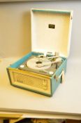 A DANSETTE BERMUDA RECORD PLAYER, in grey and teal green fitted with a Monarch turntable, inspection