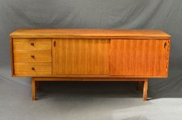 A GORDON RUSSELL OF BROADWAY TEAK SIDEBOARD, flanked by three drawers with shaped handles and double