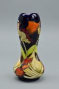 A MOORCROFT 'PARASOL DANCE' GOURD SHAPED VASE, designed by Kerry Goodwin, it bares the Moorcroft