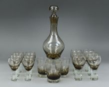A CAITHNESS GLASS 'CANISBAY' DECANTER AND TWELVE 'CANISBAY' GLASSES, in the peat colourway, six