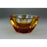 AN EXBOR SKLO UNION STUDIO GLASS FACET CUT BOWL, with ridged decoration to the top surface, amber