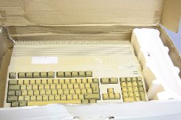 A COMMODORE AMIGA A500 PLUS VINTAGE PERSONAL COMPUTER, with power supply and mouse in original box