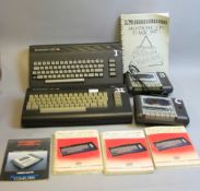 A BOX CONTAINING TWO COMMODORE 16 VINTAGE GAMING COMPUTERS, with two datassettes, three power