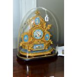 A 19TH CENTURY GILT METAL AND PORCELAIN MOUNTED MANTEL CLOCK, urn surmount above an oval painted